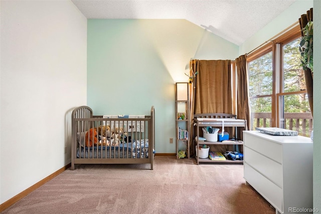 23599 Shingle Creek Rd, Golden, CO 80401 - carpeted bedroom featuring vaulted ceiling, a crib, and a textured ceiling