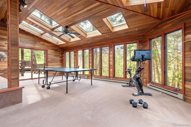 23599 Shingle Creek Rd, Golden, CO 80401 - game room featuring vaulted ceiling, a skylight, wood walls, baseboard heating, and carpet floors