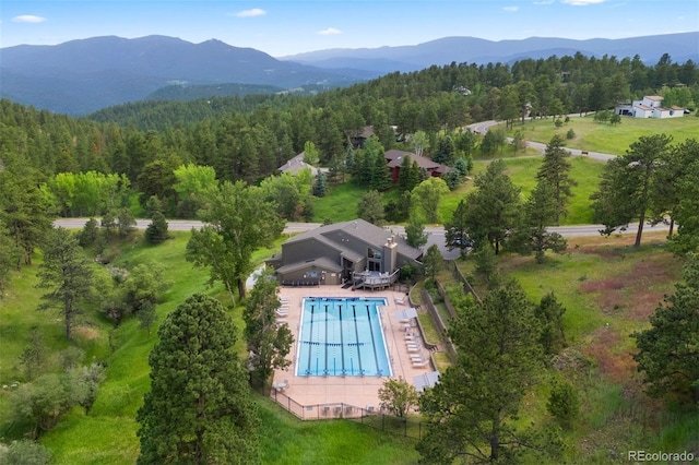 23599 Shingle Creek Rd, Golden, CO 80401 - view from above of property featuring a forest and a mountain backdrop