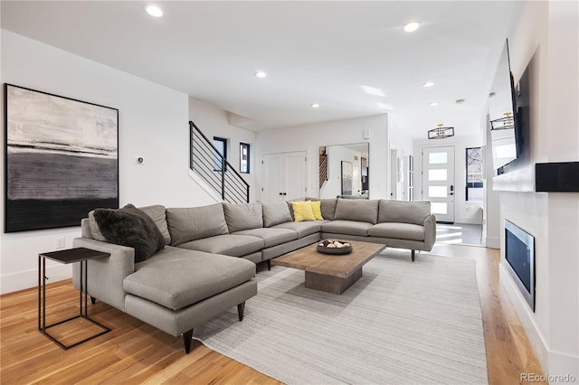 2625 W 23rd Ave, Denver, CO 80211 - living room featuring light wood-style flooring, stairs, baseboards, and recessed lighting