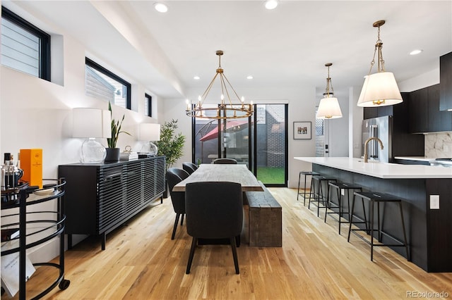 2625 W 23rd Ave, Denver, CO 80211 - dining space with recessed lighting, light wood-style flooring, and a chandelier