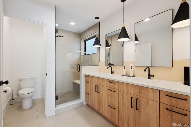 2625 W 23rd Ave, Denver, CO 80211 - bathroom featuring a stall shower, toilet, a sink, tile patterned flooring, and double vanity