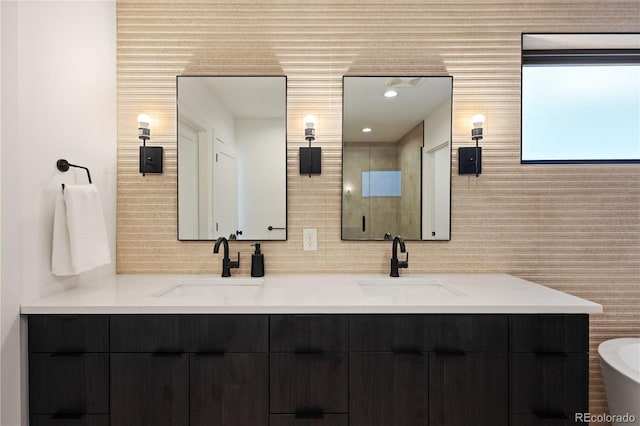 2625 W 23rd Ave, Denver, CO 80211 - bathroom with a sink, double vanity, tasteful backsplash, and a shower with door