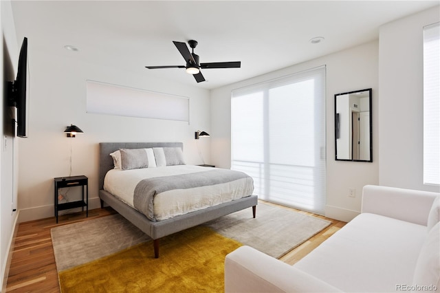 2625 W 23rd Ave, Denver, CO 80211 - bedroom with ceiling fan, baseboards, and wood finished floors