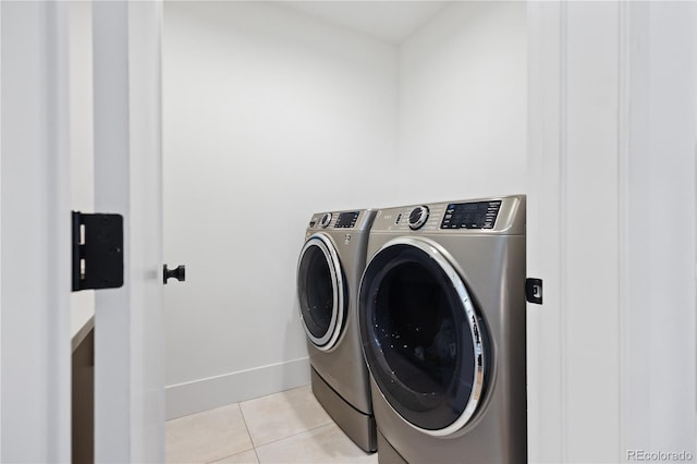 2625 W 23rd Ave, Denver, CO 80211 - washroom with light tile patterned floors, baseboards, laundry area, and washer and clothes dryer