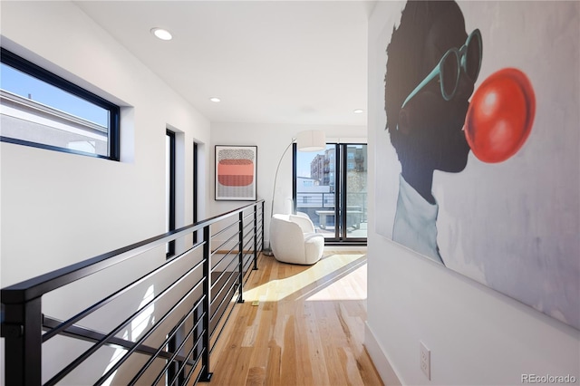 2625 W 23rd Ave, Denver, CO 80211 - corridor with a healthy amount of sunlight, light wood-style floors, an upstairs landing, and recessed lighting