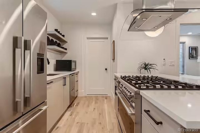 2625 W 23rd Ave, Denver, CO 80211 - kitchen with modern cabinets, light wood finished floors, open shelves, light countertops, and appliances with stainless steel finishes