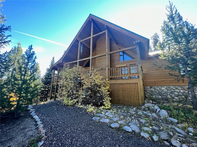 view of side of home featuring a deck