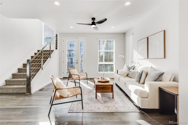 living room featuring hardwood / wood-style flooring and ceiling fan