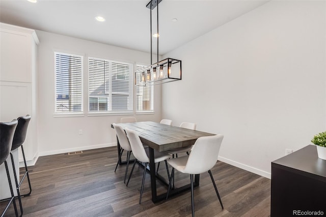 dining space featuring dark hardwood / wood-style floors