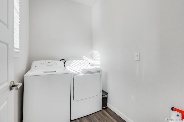 washroom with independent washer and dryer and dark hardwood / wood-style flooring