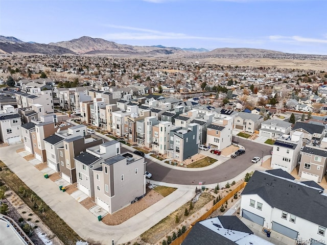 birds eye view of property featuring a mountain view