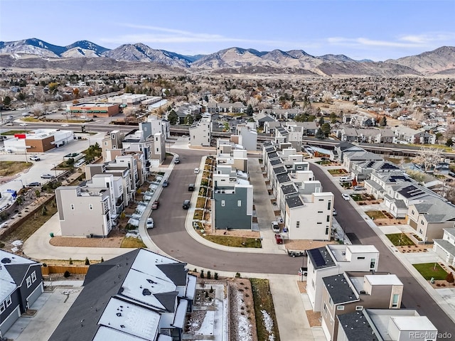 birds eye view of property with a mountain view