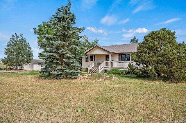 ranch-style home with a front yard and a porch