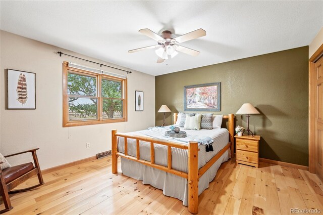 bedroom featuring ceiling fan and light hardwood / wood-style flooring