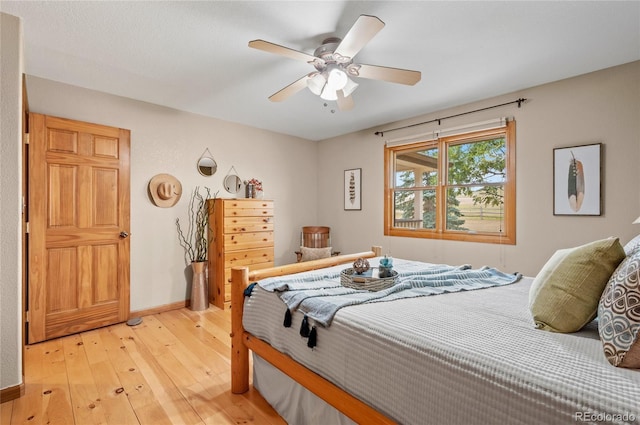 bedroom with ceiling fan and light wood-type flooring