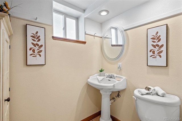 bathroom featuring toilet