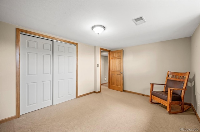 living area featuring light colored carpet