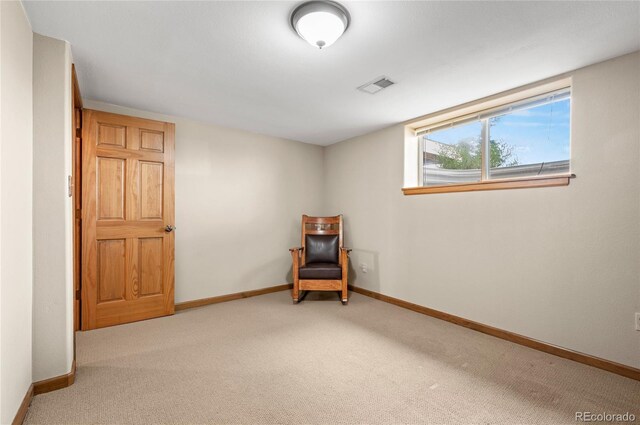 living area featuring light colored carpet