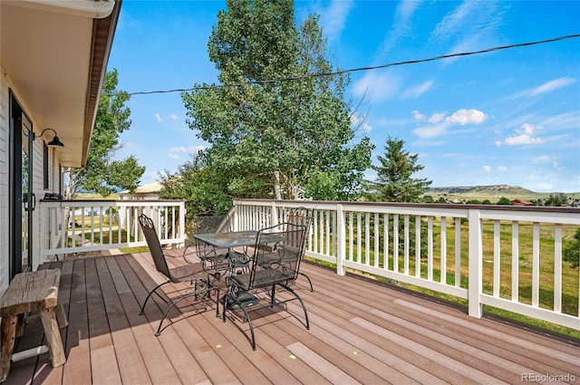 wooden deck featuring a yard