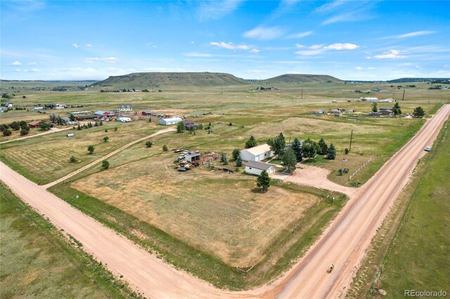 bird's eye view featuring a rural view and a mountain view