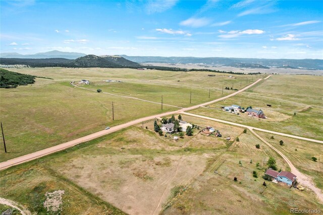 aerial view featuring a rural view and a mountain view