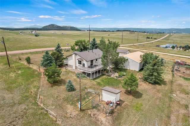 aerial view featuring a rural view and a mountain view