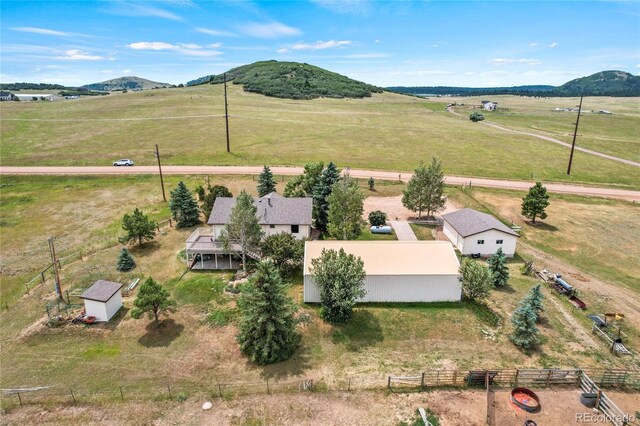 birds eye view of property with a rural view and a mountain view