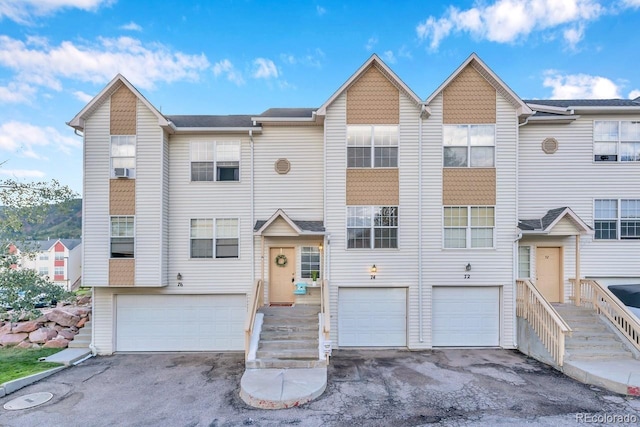 townhome / multi-family property featuring a garage