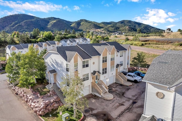 birds eye view of property featuring a mountain view