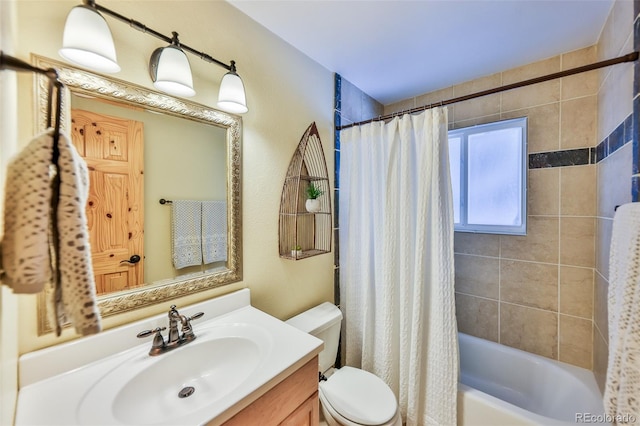 full bathroom featuring vanity, toilet, and shower / tub combo