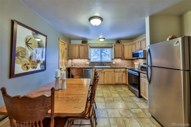 kitchen featuring tasteful backsplash, sink, stainless steel appliances, and light brown cabinetry