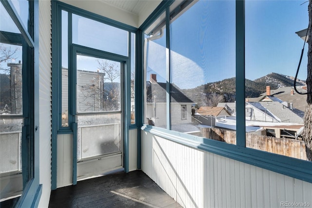 sunroom / solarium featuring a mountain view