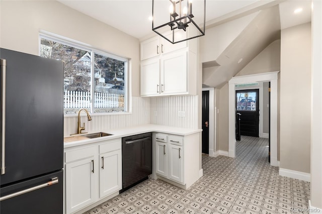 kitchen with white cabinetry, black dishwasher, high end refrigerator, hanging light fixtures, and a healthy amount of sunlight