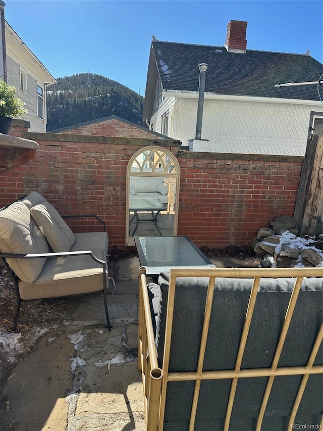 view of patio / terrace featuring a mountain view