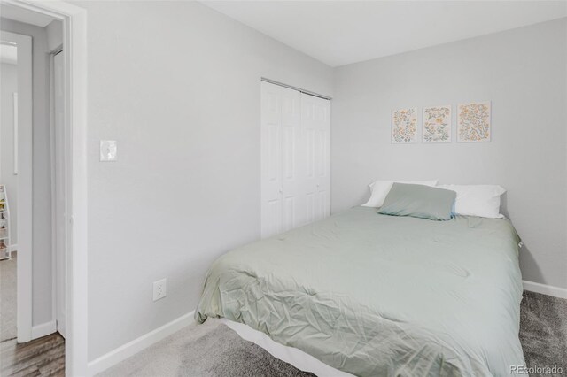 carpeted bedroom featuring a closet