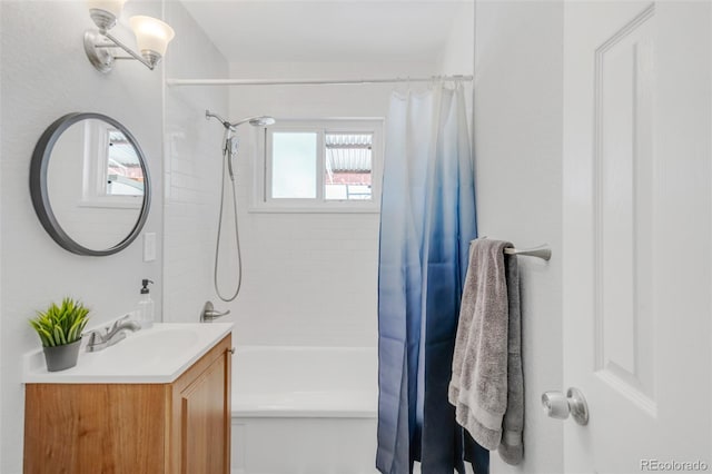 bathroom featuring shower / bath combination with curtain and vanity