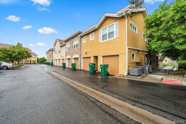 202 Lucca Dr, Evans, CO 80620 - view of asphalt road featuring a residential view and curbs