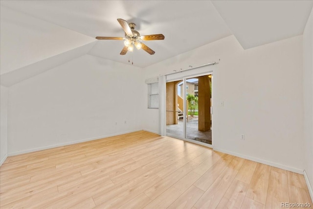 202 Lucca Dr, Evans, CO 80620 - empty room featuring a ceiling fan, light wood finished floors, baseboards, and vaulted ceiling