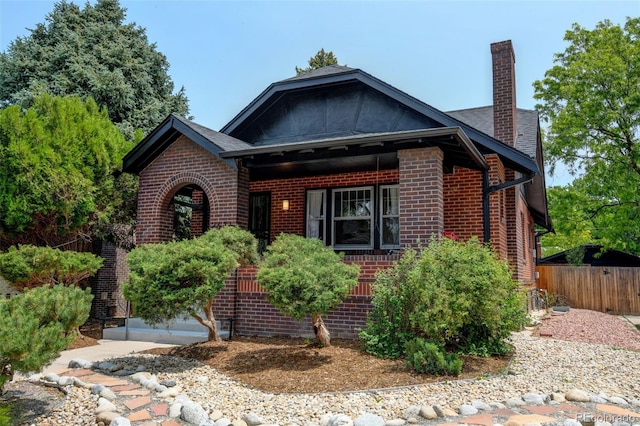 2636 N Glencoe St, Denver, CO 80207 - view of front of home featuring brick siding and a chimney