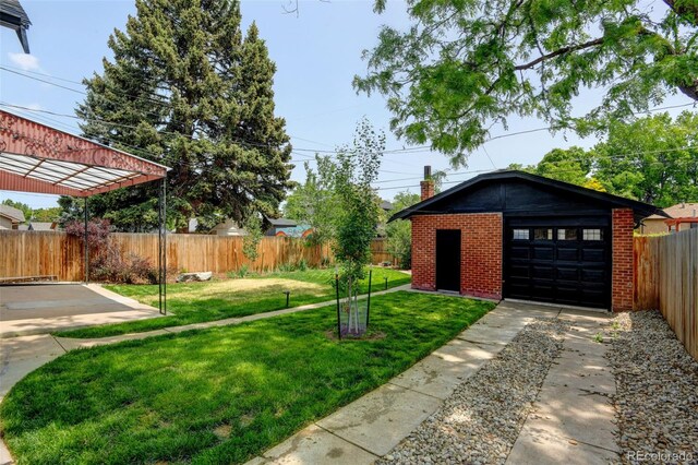 2636 N Glencoe St, Denver, CO 80207 - view of yard with an outdoor structure and a detached garage