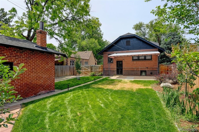 2636 N Glencoe St, Denver, CO 80207 - back of property with brick siding, a patio, and a chimney