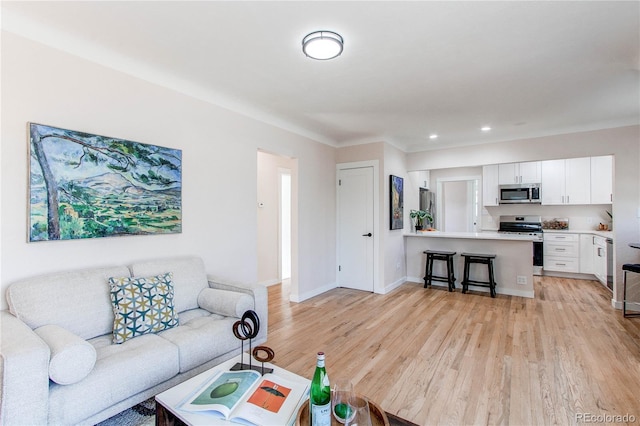 1969 Uinta St, Denver, CO 80220 - living area featuring light wood-style floors and recessed lighting