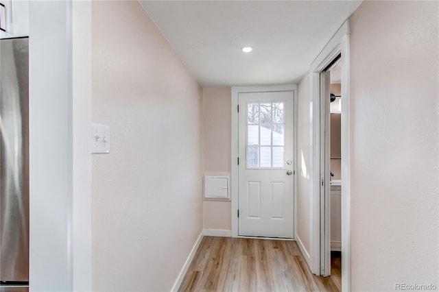 1969 Uinta St, Denver, CO 80220 - doorway to outside featuring light wood-style flooring and baseboards
