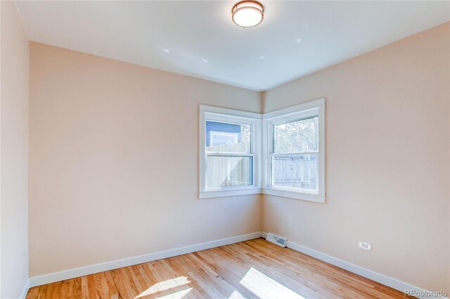 1969 Uinta St, Denver, CO 80220 - spare room featuring baseboards and light wood-type flooring