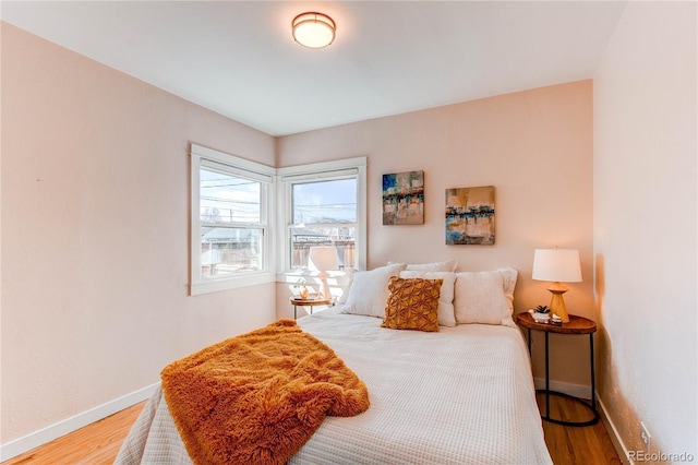 1969 Uinta St, Denver, CO 80220 - bedroom with baseboards and light wood-style flooring