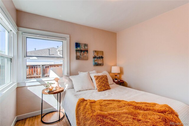 1969 Uinta St, Denver, CO 80220 - bedroom featuring wood finished floors and baseboards