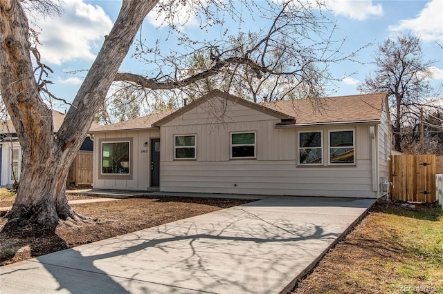 1969 Uinta St, Denver, CO 80220 - view of front of home with roof with shingles and driveway