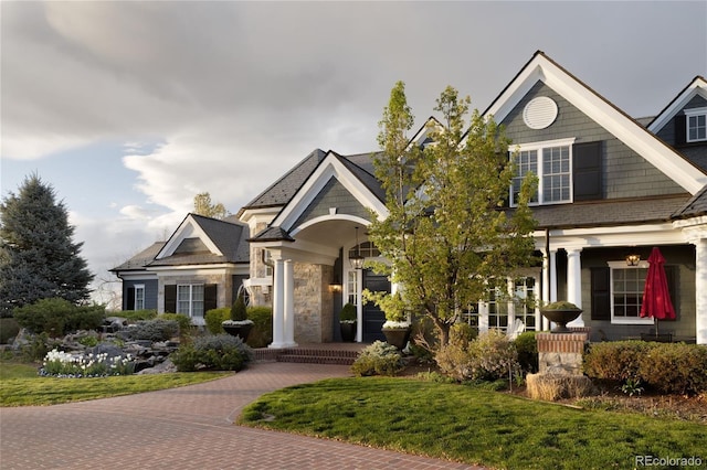 5470 S Highline Cir, Greenwood Village, CO 80121 - craftsman house featuring a front yard and stone siding
