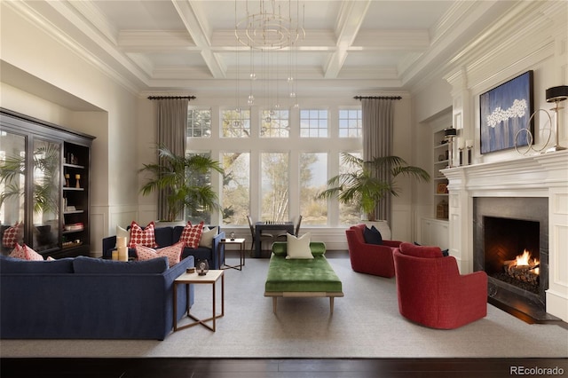 5470 S Highline Cir, Greenwood Village, CO 80121 - living area featuring beamed ceiling, a warm lit fireplace, coffered ceiling, crown molding, and a towering ceiling